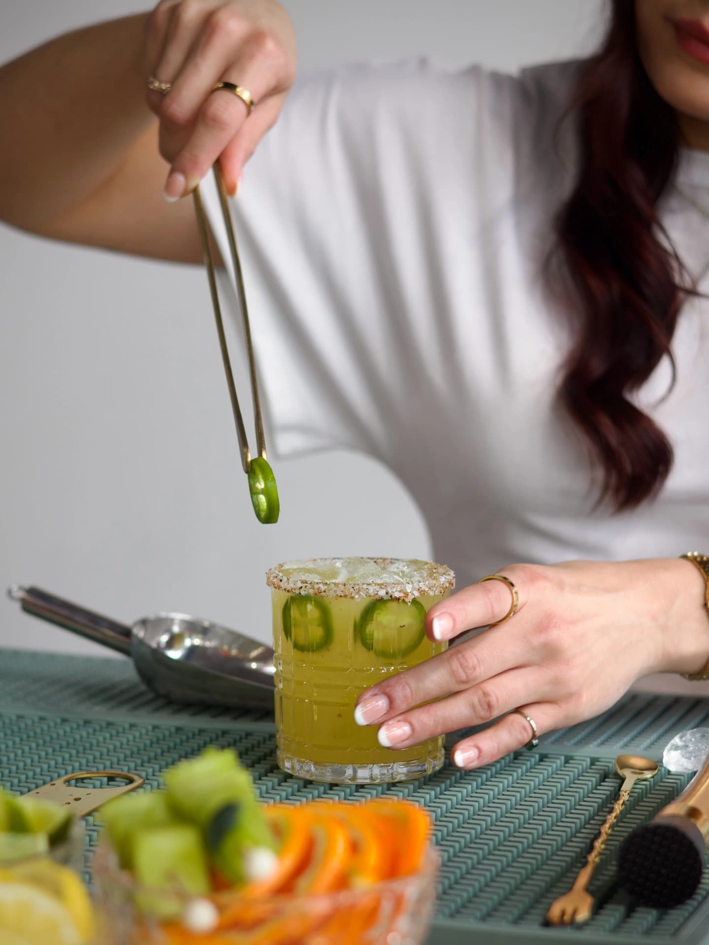 A finished jalapeno margarita with a pepper garnish.
