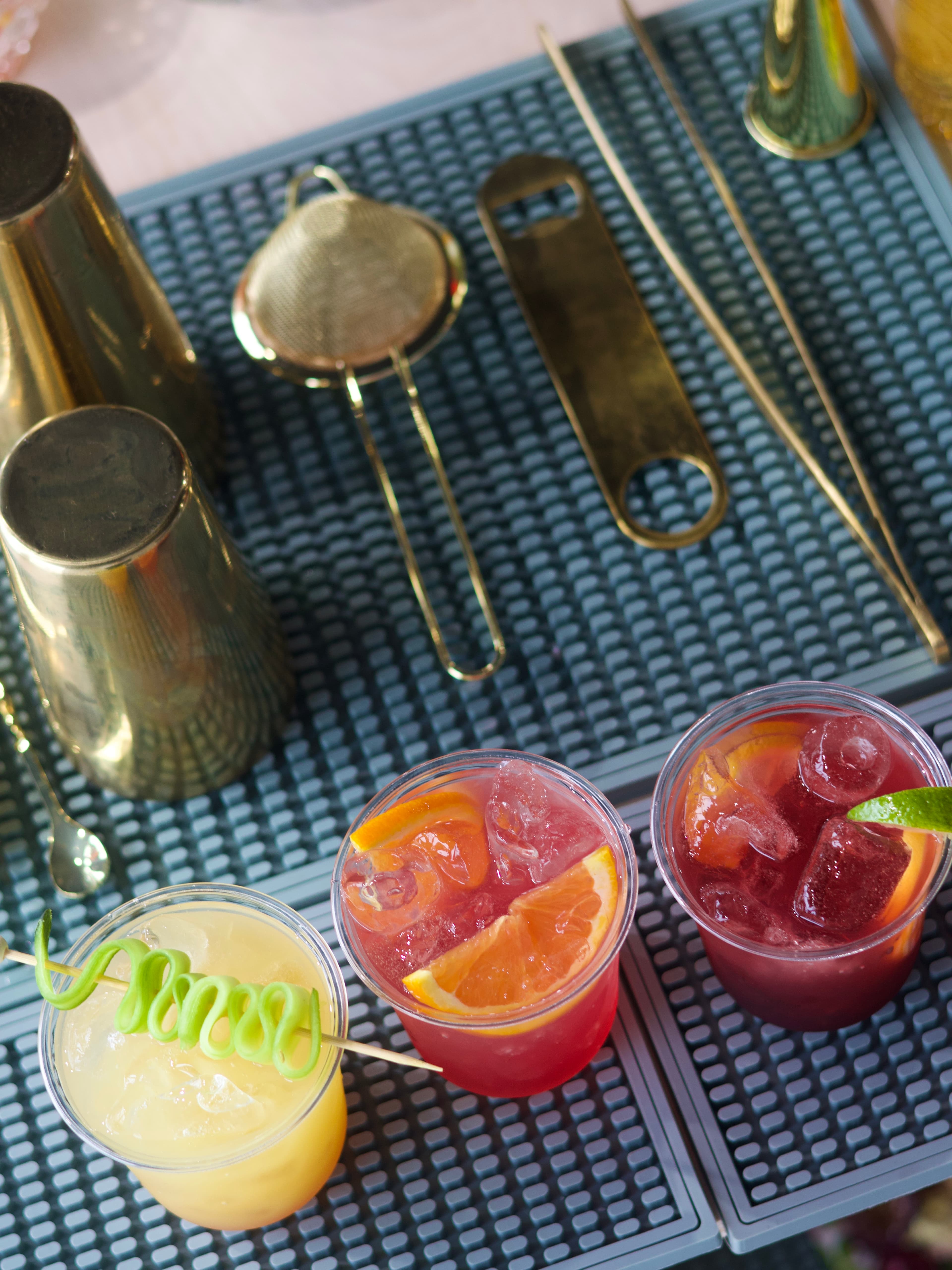 A styled spread of cocktails and bar details on the Clover mobile bar.