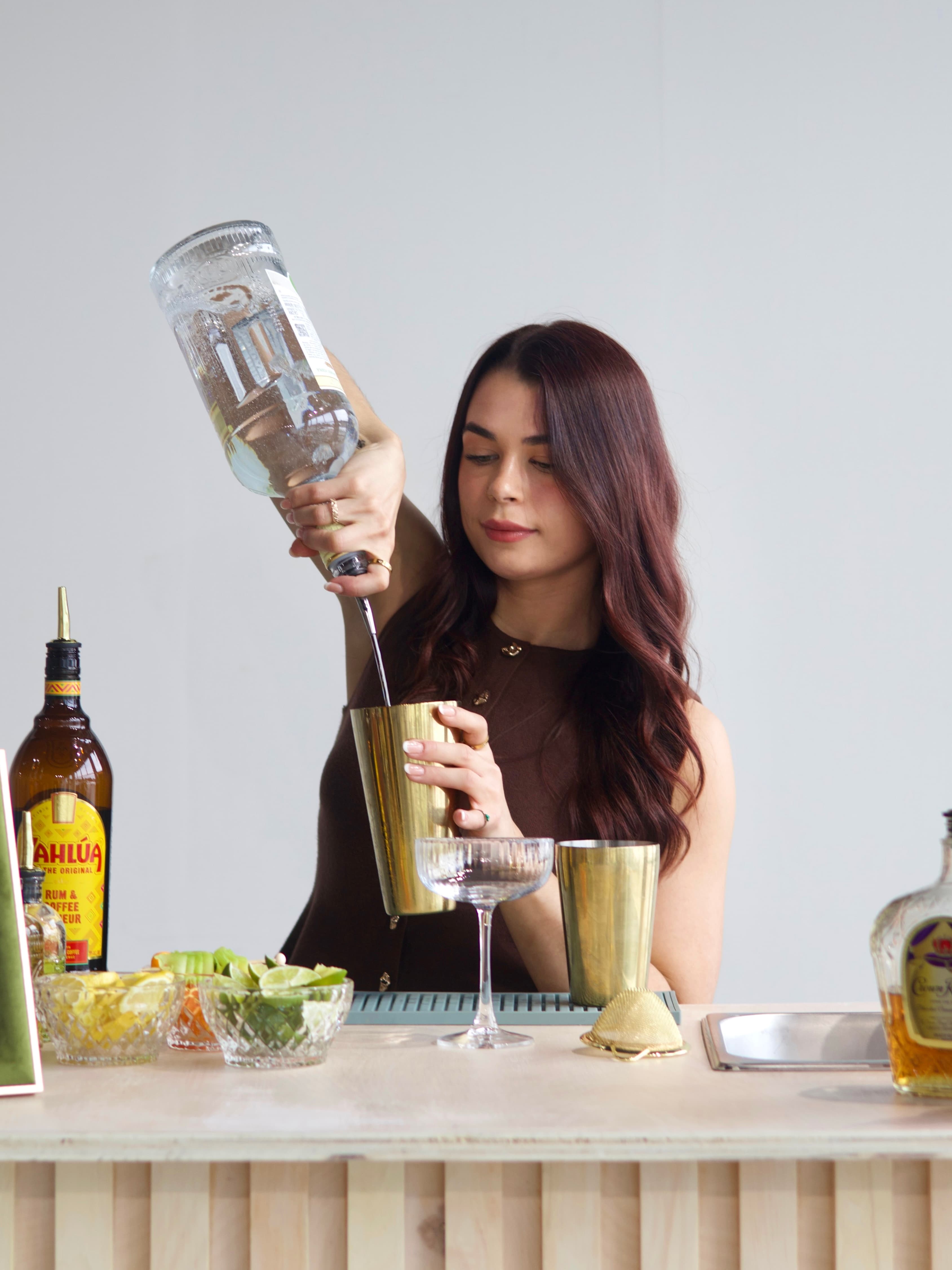 Sydni serving cocktails from behind the Clover mobile bar.