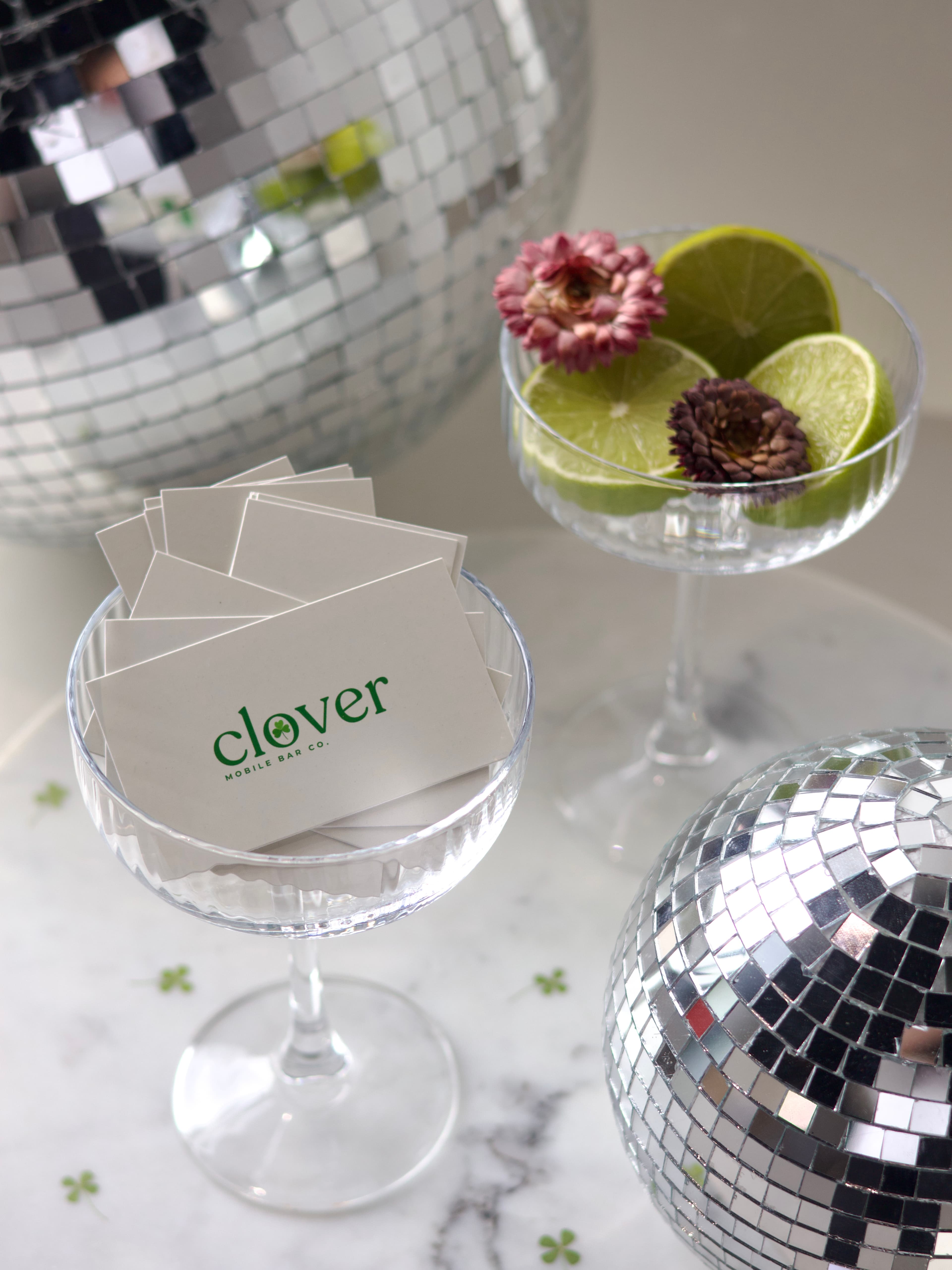 Planning materials and a curated shopping list for a Clover event.